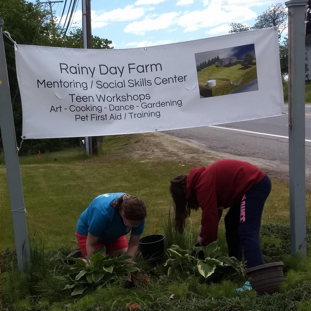 Kids gardening at Rainy Day Farm Mentoring