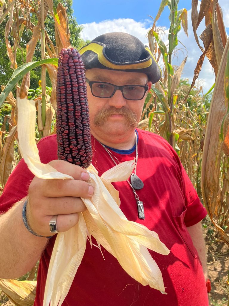 Grower holding corn