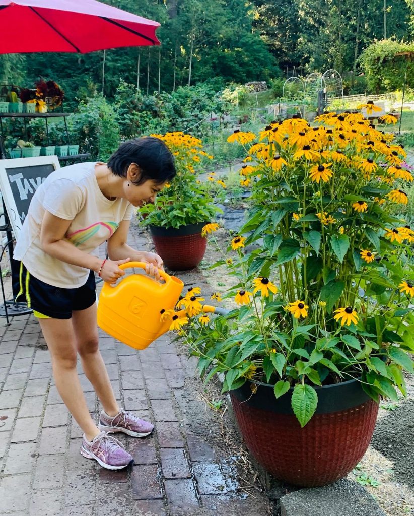 Girl watering flowers