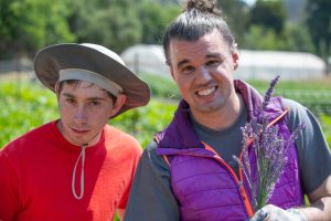 2 men gardening and smiling