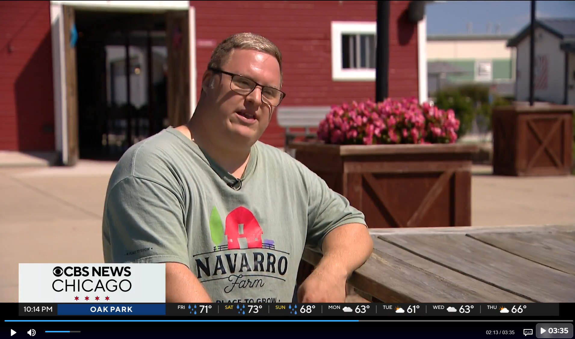 An individual wearing a Navarro Farm shirt on CBS News Chicago